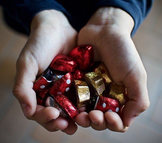 a handful chocolates as reward